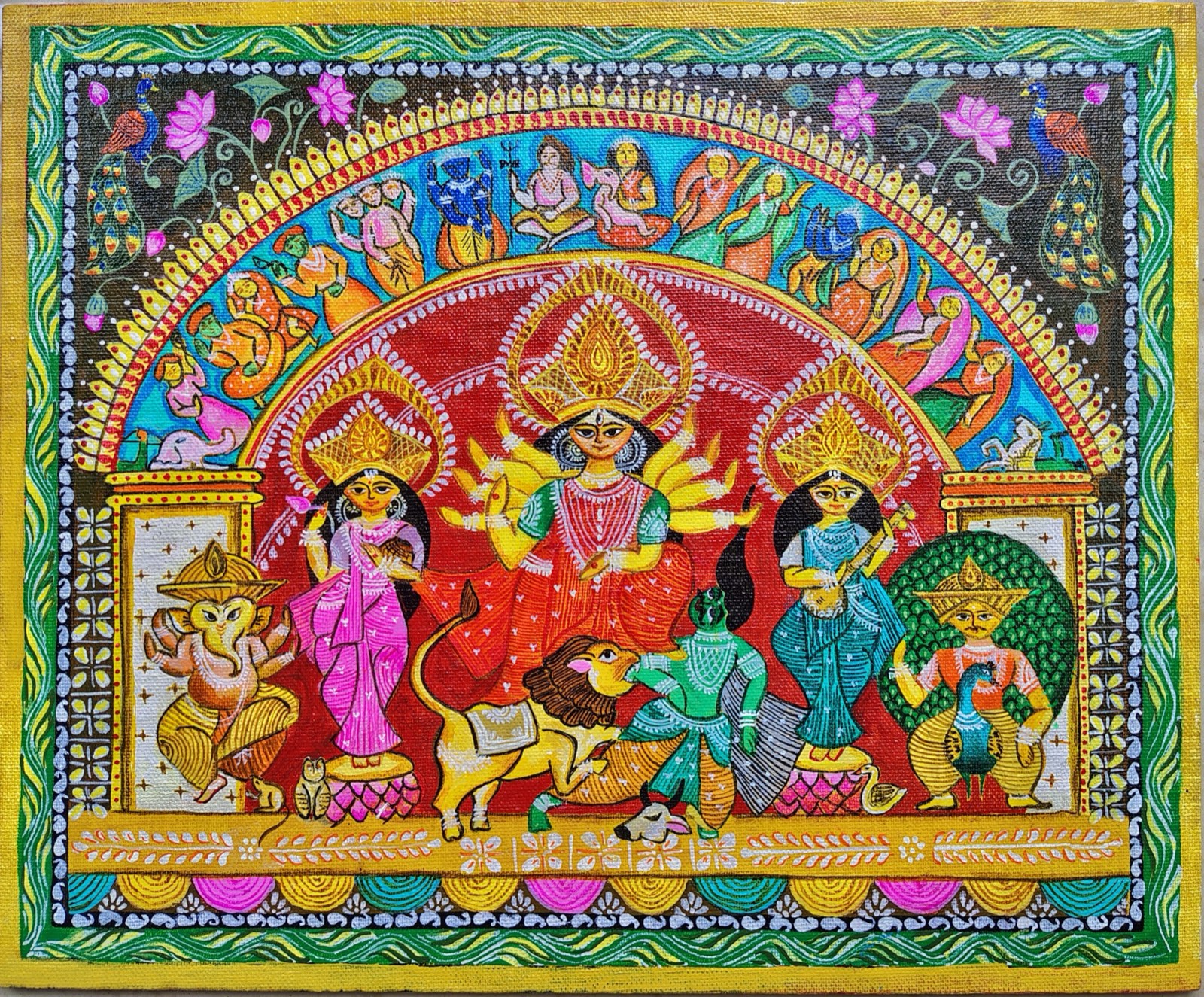 Durga with Lakshmi, Saraswati, Ganesha and Kartikeya beneath a painted arch of deities, framed by lotuses, peacocks and a green and gold border.